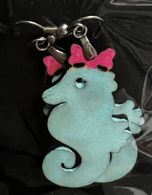 Light Blue seahorse with pink bow laser cut earrings